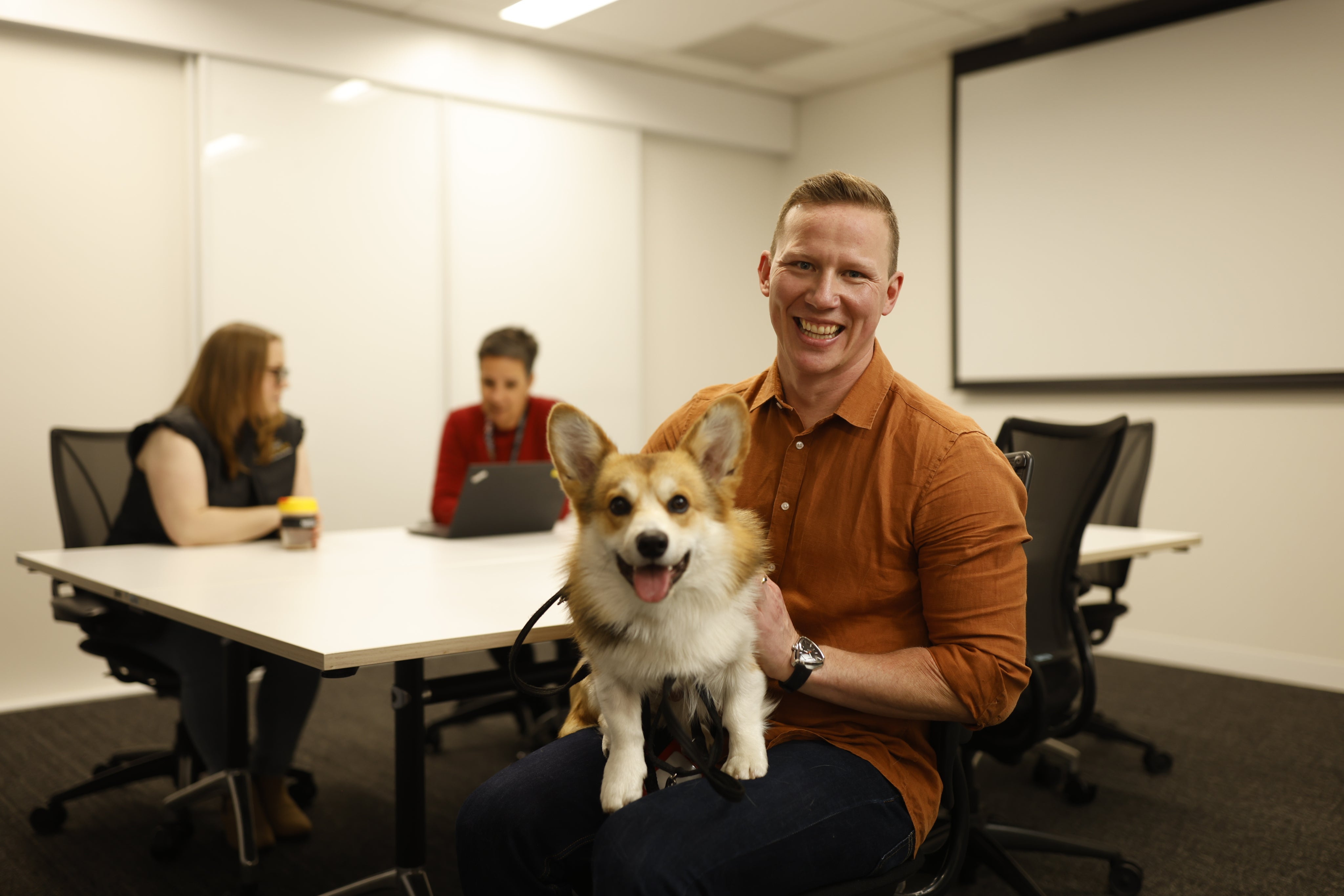 Man with dog in office
